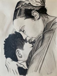 Portrait en noir et blanc d'une femme, Joséphine Baker, serrant contre elle un enfant.